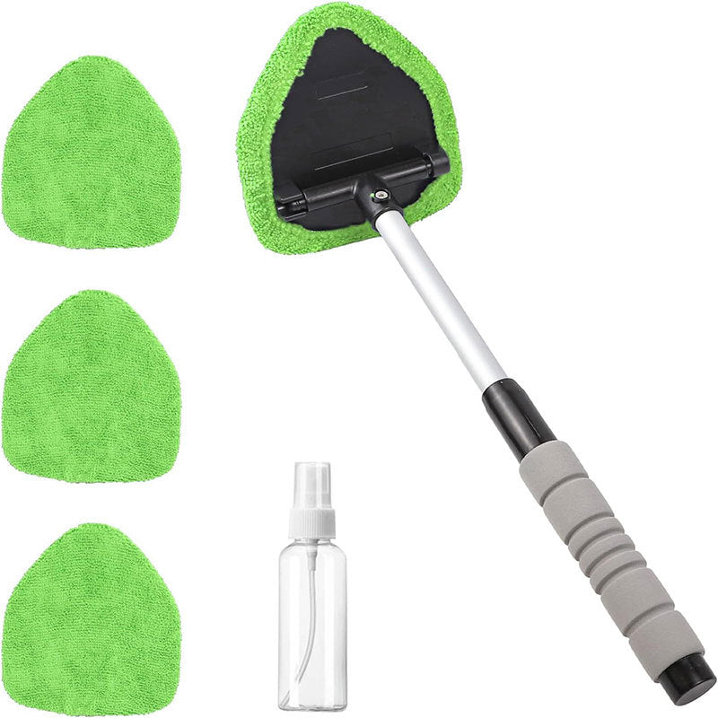 Cleaning tool set with green cloths, spray bottle, and extendable handle on a white background