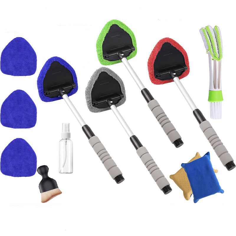 Set of cleaning brushes with different colored pads and handles on a white background.