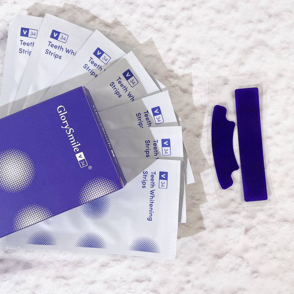 Teeth whitening strips with packaging on a textured surface