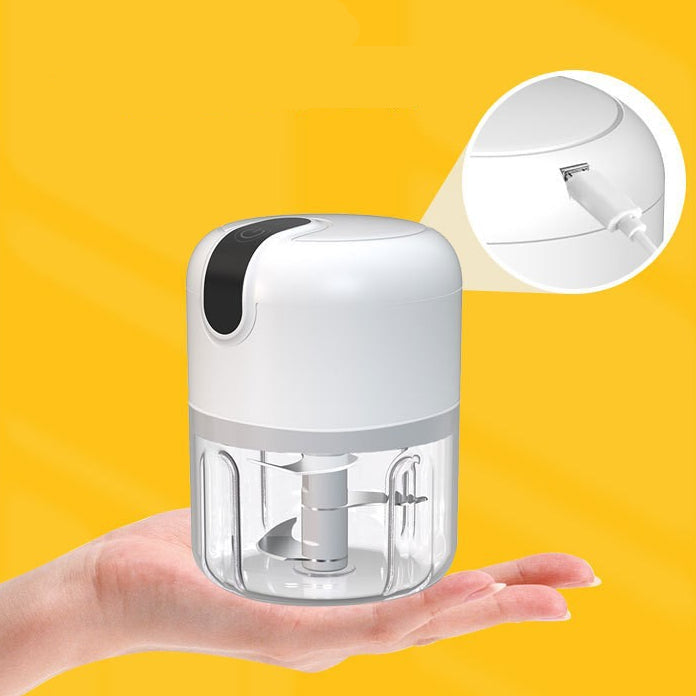 Small electric grinder held in a hand with yellow background and text