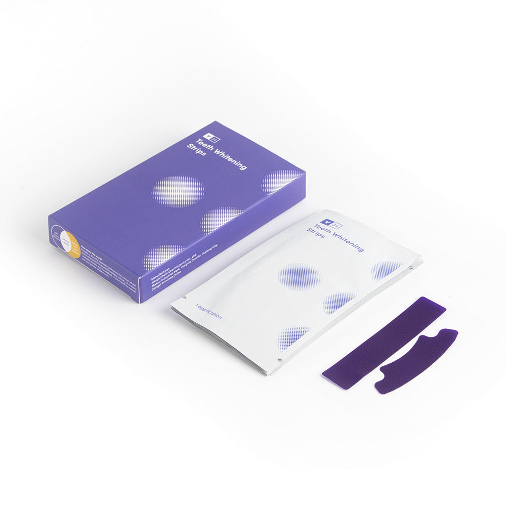 Packaging of teeth whitening strips with a purple box and white packets on a white background