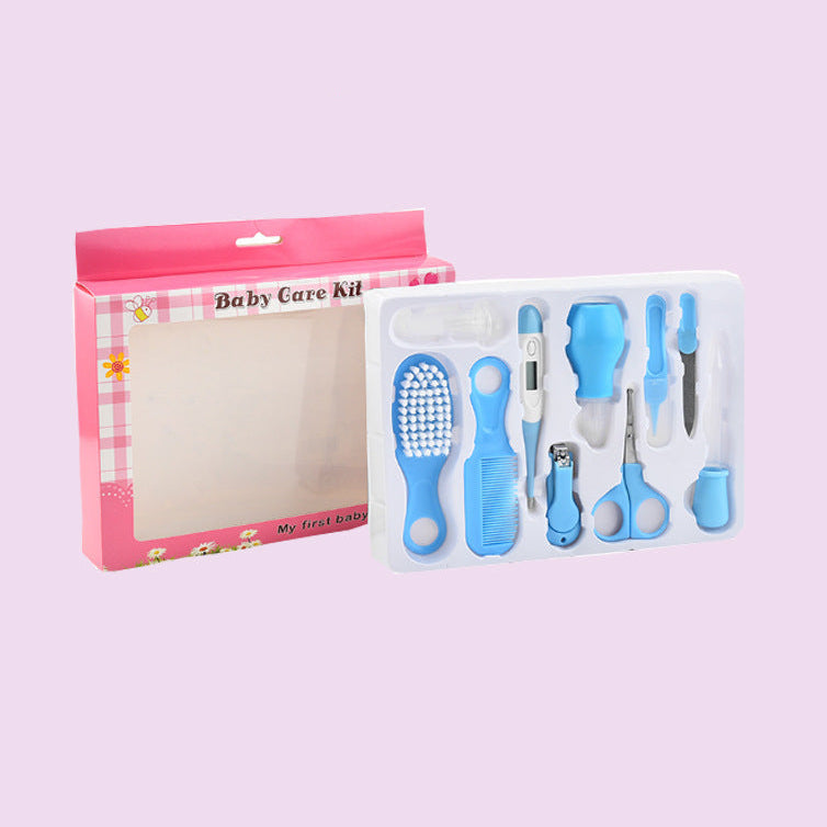 Baby care kit with blue tools in a pink box on a light purple background