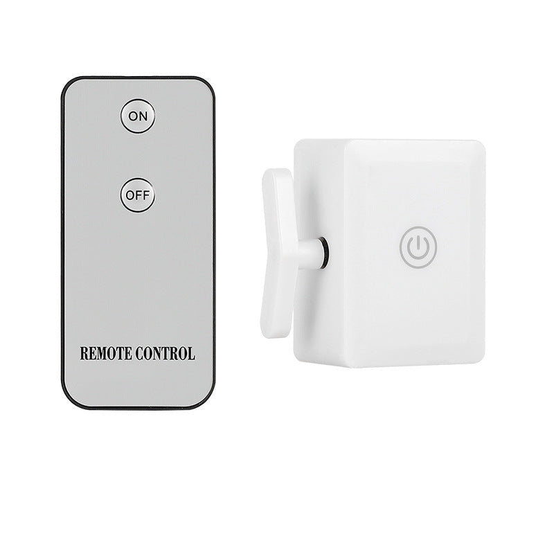 Remote control and light switch remote on a white background.