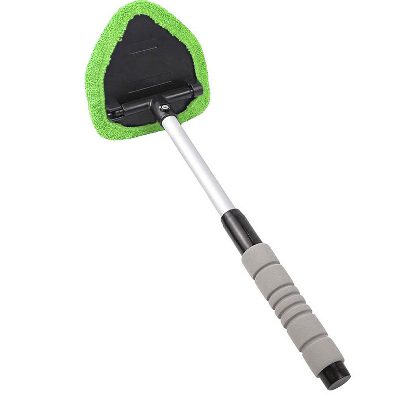 Car windshield cleaning tool with green microfiber pad on a white background